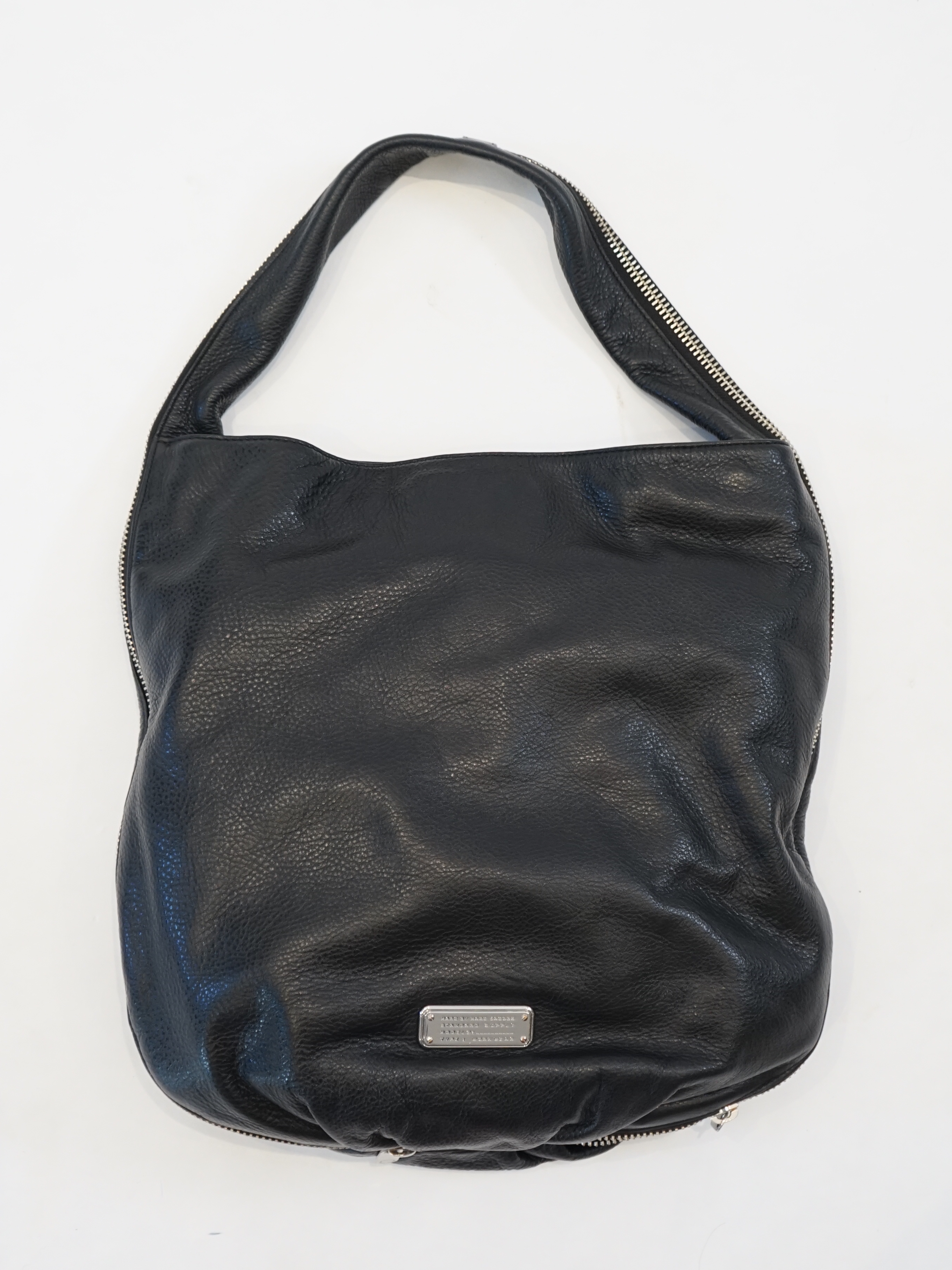 A Marc Jacobs black leather boho with silver zip detail, width 40cm, depth 15cm, height 35cm
